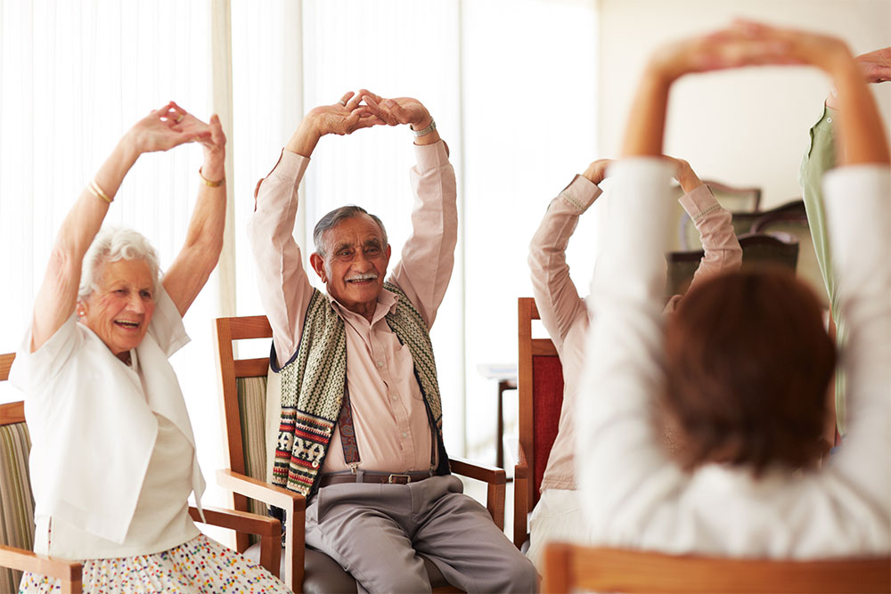 elderly people doing stretching exercises