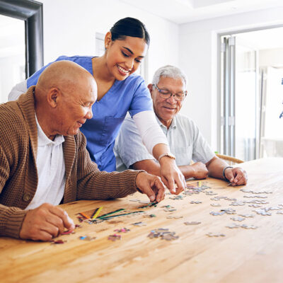 senior men playing a puzzle game